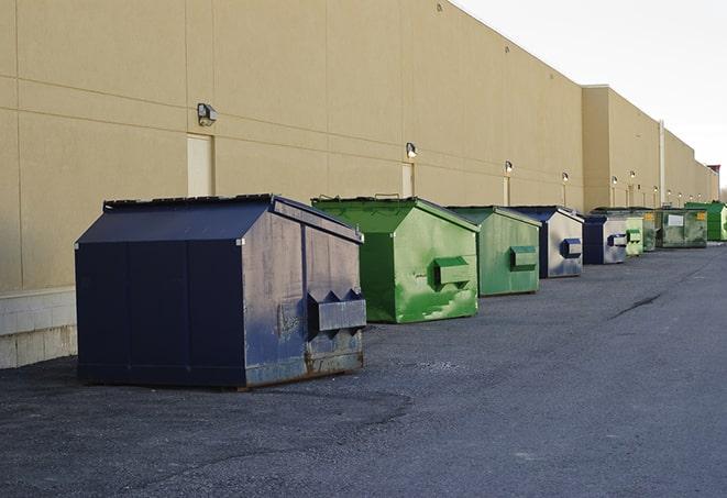 brightly colored dumpsters filled with construction waste in Berea